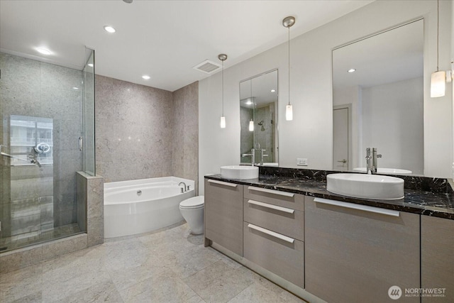 737 Olive Way Unit 1903, Seattle, WA 98101 - bathroom featuring a bath, double vanity, a stall shower, and recessed lighting