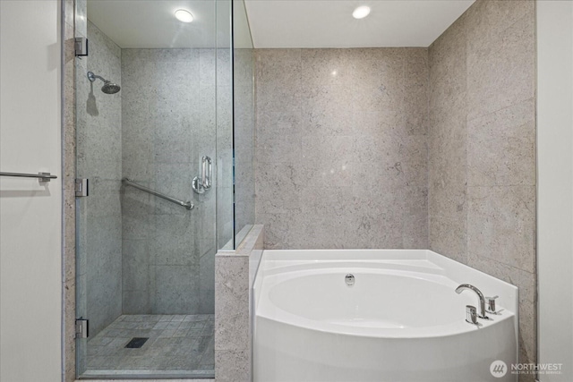 737 Olive Way Unit 1903, Seattle, WA 98101 - bathroom featuring a garden tub, a shower stall, and recessed lighting