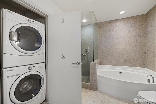 737 Olive Way Unit 1903, Seattle, WA 98101 - washroom with stacked washing machine and dryer and recessed lighting