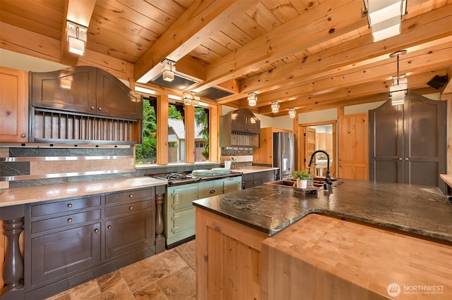 991 Lakeview St, Bellingham, WA 98229 - kitchen with appliances with stainless steel finishes, a wood ceiling with exposed beams, dark stone counters, and light stone finish flooring