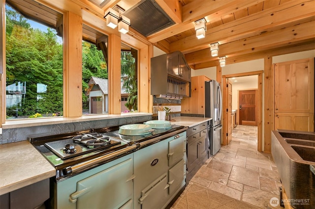 991 Lakeview St, Bellingham, WA 98229 - kitchen with stone tile floors, stainless steel fridge, and plenty of natural light