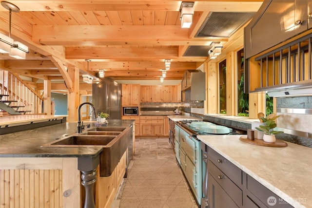 991 Lakeview St, Bellingham, WA 98229 - kitchen with stainless steel microwave, wooden ceiling, light brown cabinets, backsplash, and a kitchen island with sink