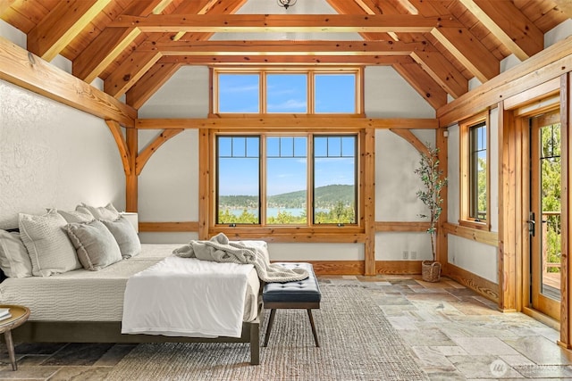991 Lakeview St, Bellingham, WA 98229 - bedroom featuring stone tile floors, beam ceiling, and high vaulted ceiling