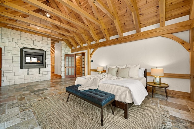 991 Lakeview St, Bellingham, WA 98229 - bedroom with stone tile floors, wooden ceiling, and a fireplace