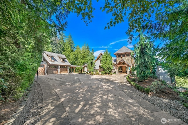 991 Lakeview St, Bellingham, WA 98229 - view of front of home featuring a garage, driveway, and stone siding