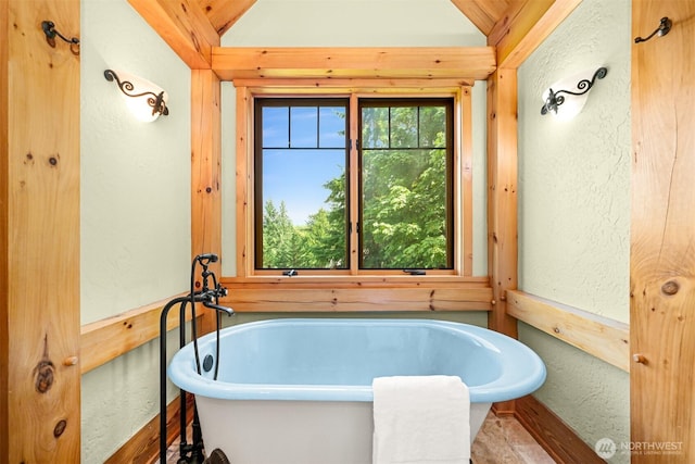 991 Lakeview St, Bellingham, WA 98229 - bathroom with a textured wall, vaulted ceiling, and a freestanding tub