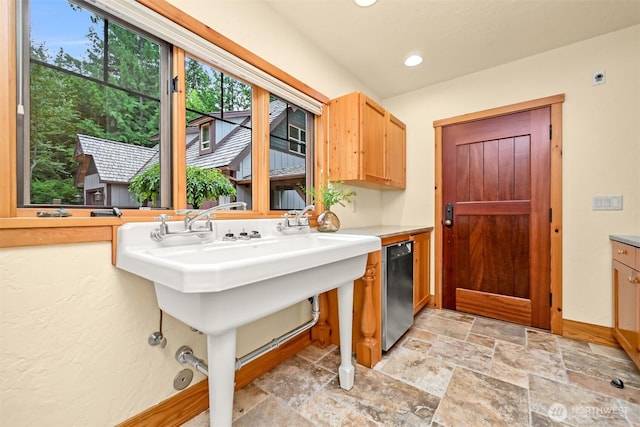 991 Lakeview St, Bellingham, WA 98229 - laundry room featuring light stone finish flooring and recessed lighting