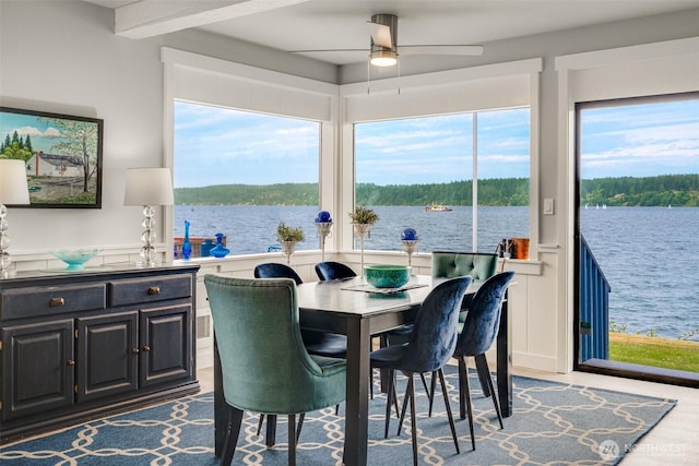 5341 S Bercot Rd, Freeland, WA 98249 - dining space with a water view, ceiling fan, and wood finished floors