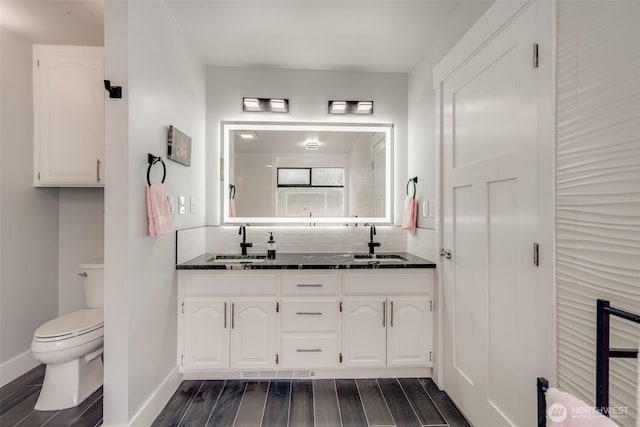 5341 S Bercot Rd, Freeland, WA 98249 - full bathroom featuring double vanity, wood finished floors, and backsplash