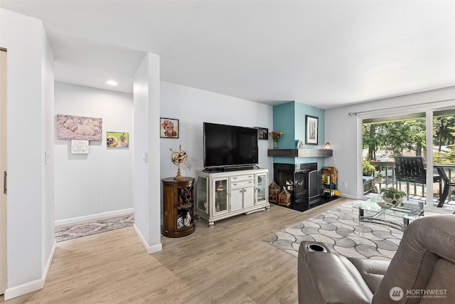 7501 Ruby Dr SW Unit G202, Lakewood, WA 98498 - living area with a fireplace, wood finished floors, and recessed lighting