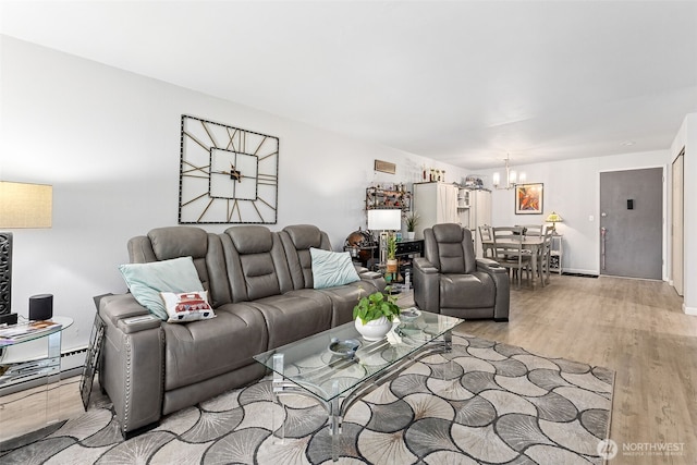 7501 Ruby Dr SW Unit G202, Lakewood, WA 98498 - living room with a chandelier and light wood-style floors