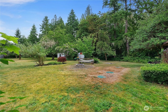 5140 Johnson Point Rd NE, Olympia, WA 98516 - view of green lawn featuring a fire pit