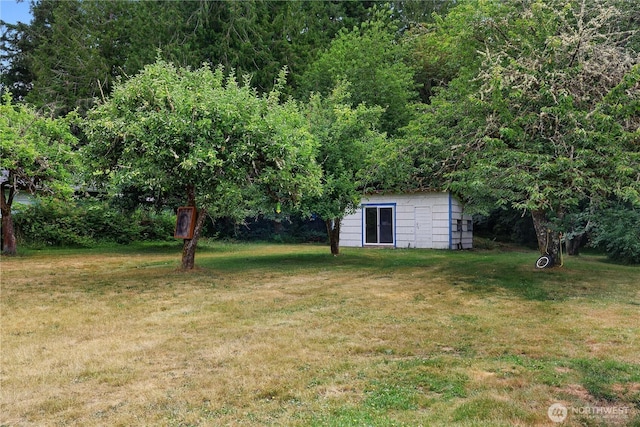 5140 Johnson Point Rd NE, Olympia, WA 98516 - view of grassy yard with a storage shed