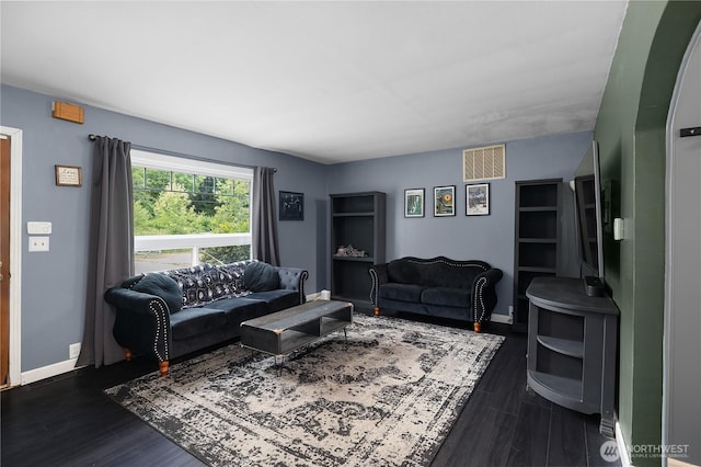 5140 Johnson Point Rd NE, Olympia, WA 98516 - living room featuring dark wood-style flooring and baseboards