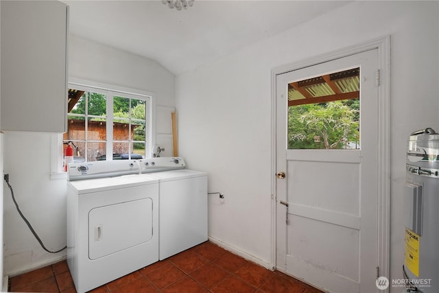 5140 Johnson Point Rd NE, Olympia, WA 98516 - laundry area with separate washer and dryer, dark tile patterned floors, and water heater
