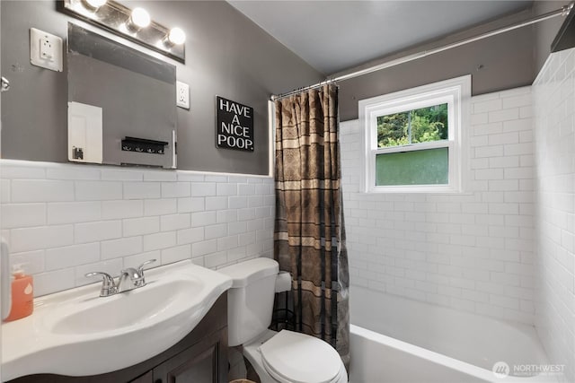 5140 Johnson Point Rd NE, Olympia, WA 98516 - bathroom featuring tile walls, vanity, shower / bath combo with shower curtain, and wainscoting