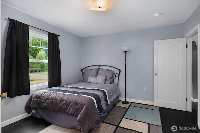 5140 Johnson Point Rd NE, Olympia, WA 98516 - bedroom featuring wood finished floors and baseboards