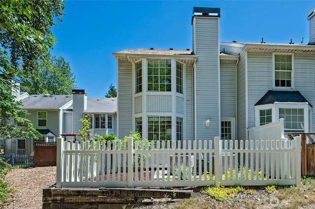 10263 NE 129th Ln, Kirkland, WA 98034 - back of house with a chimney