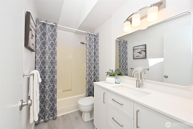 10263 NE 129th Ln, Kirkland, WA 98034 - full bath featuring wood finished floors, vanity, and shower / tub combo