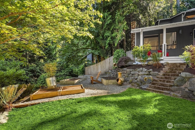 6687 NE Bayview Blvd, Bainbridge Island, WA 98110 - view of green lawn featuring a garden and a sunroom