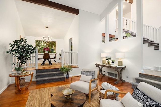 6687 NE Bayview Blvd, Bainbridge Island, WA 98110 - living area with stairs, a chandelier, wood finished floors, high vaulted ceiling, and beamed ceiling