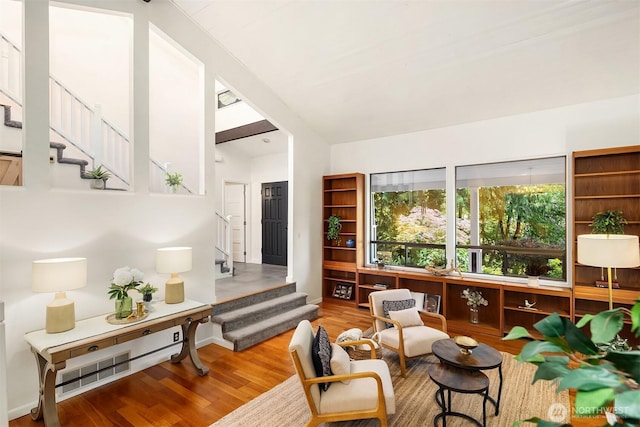 6687 NE Bayview Blvd, Bainbridge Island, WA 98110 - living area featuring stairs, wood finished floors, and lofted ceiling