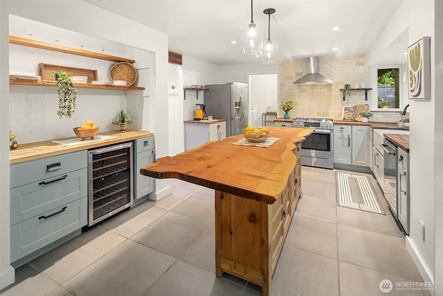 6687 NE Bayview Blvd, Bainbridge Island, WA 98110 - kitchen with butcher block countertops, open shelves, appliances with stainless steel finishes, beverage cooler, and recessed lighting