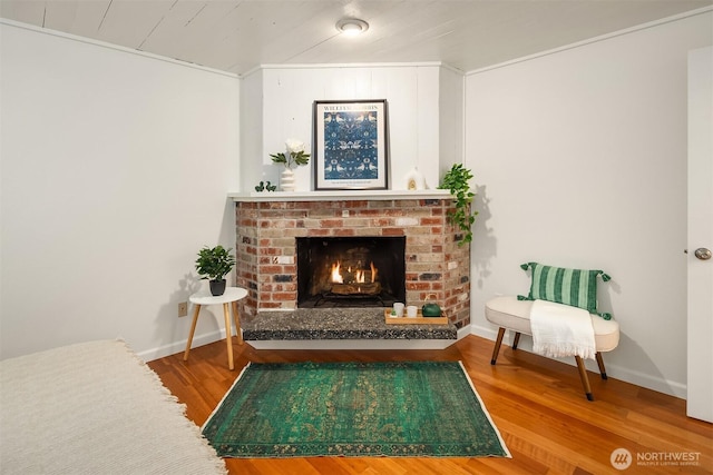 6687 NE Bayview Blvd, Bainbridge Island, WA 98110 - sitting room with wood finished floors and a fireplace
