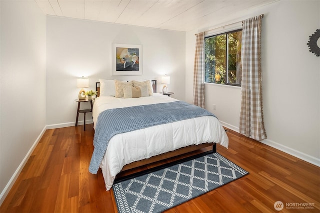 6687 NE Bayview Blvd, Bainbridge Island, WA 98110 - bedroom featuring wood finished floors and baseboards