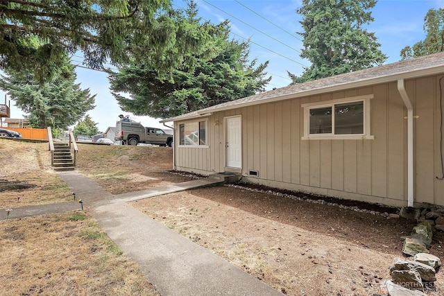 6610 S Madison St, Tacoma, WA 98409 - view of exterior entry featuring a shingled roof