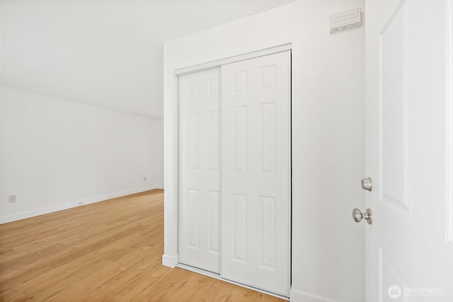 6610 S Madison St, Tacoma, WA 98409 - unfurnished bedroom with light wood-type flooring and a closet
