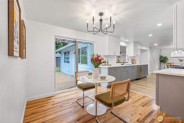 8808 NE 139th St, Kirkland, WA 98034 - dining area featuring a chandelier, light wood-type flooring, and recessed lighting