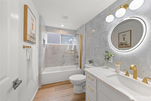 8808 NE 139th St, Kirkland, WA 98034 - bathroom featuring vanity, shower / tub combination, wood finished floors, and tile walls