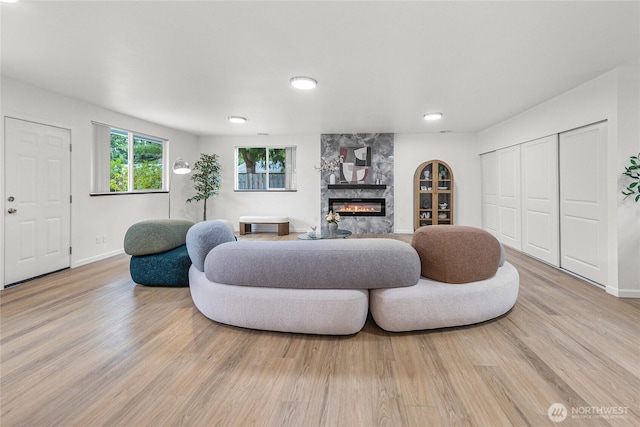 8808 NE 139th St, Kirkland, WA 98034 - living room featuring a premium fireplace and light wood finished floors