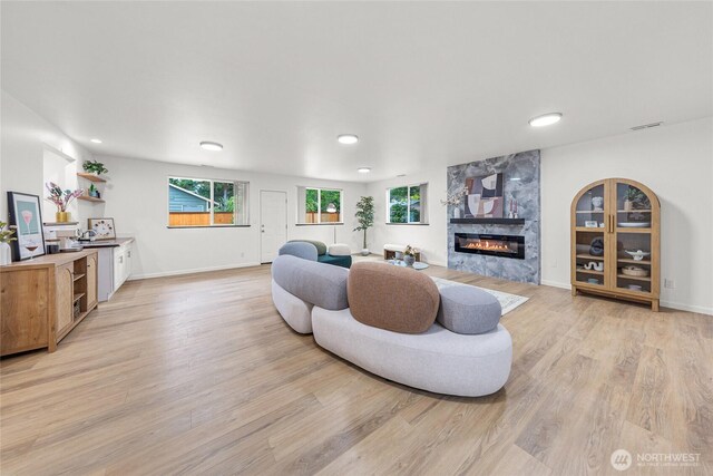 8808 NE 139th St, Kirkland, WA 98034 - living room featuring a premium fireplace, light wood-style floors, and recessed lighting