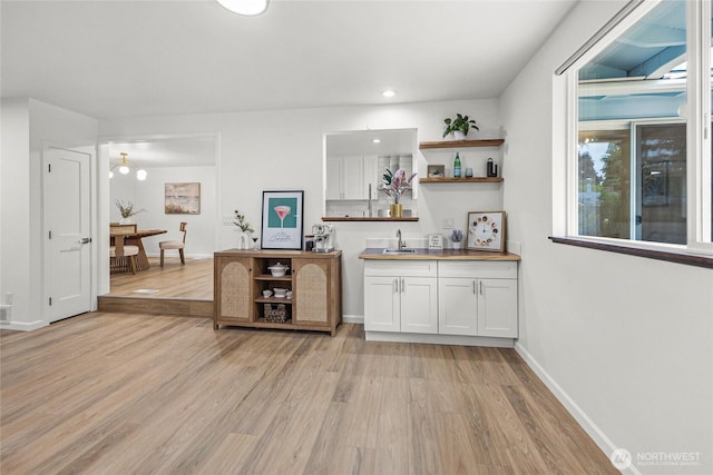 8808 NE 139th St, Kirkland, WA 98034 - bar featuring light wood-type flooring and recessed lighting