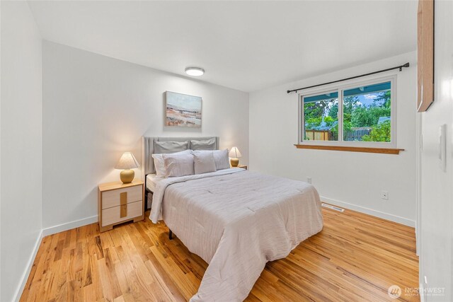 8808 NE 139th St, Kirkland, WA 98034 - bedroom with baseboards and light wood-type flooring