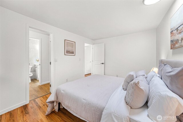 8808 NE 139th St, Kirkland, WA 98034 - bedroom with wood finished floors and ensuite bath