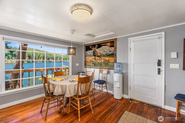 1205 Summit Lake Shore Rd NW, Olympia, WA 98502 - dining room featuring wood-type flooring, attic access, crown molding, and a water view