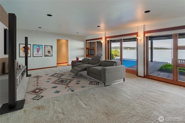 9913 Point View St NE, Olympia, WA 98516 - carpeted living room featuring a water view and baseboards