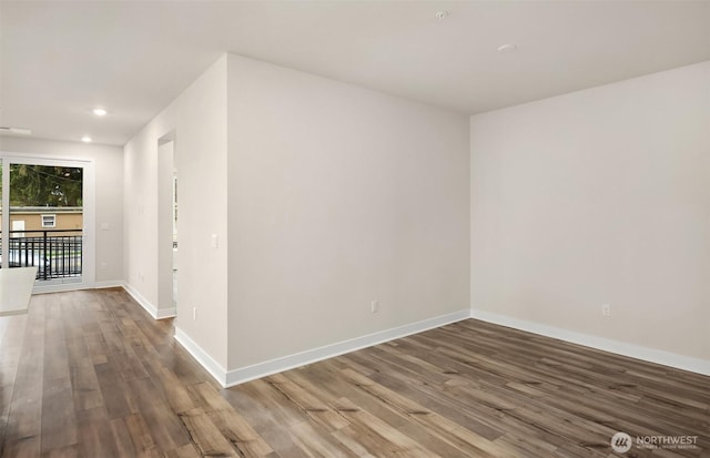 6901 NE 184th Ln Unit 103, Kenmore, WA 98028 - empty room with wood finished floors and recessed lighting