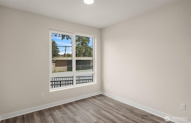 6901 NE 184th Ln Unit 103, Kenmore, WA 98028 - unfurnished room featuring wood finished floors and baseboards