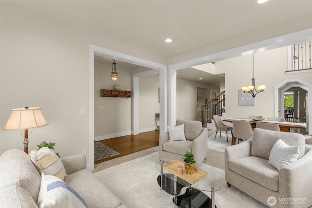 3414 SE 223rd Ave, Sammamish, WA 98075 - living area with stairs, a chandelier, and recessed lighting