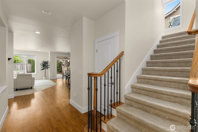 3414 SE 223rd Ave, Sammamish, WA 98075 - stairs with wood finished floors and recessed lighting
