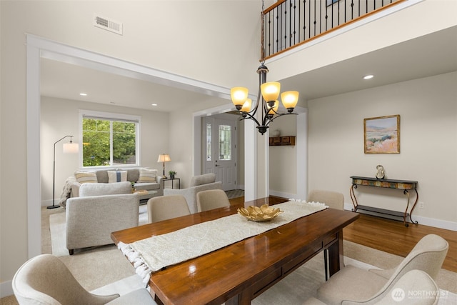 3414 SE 223rd Ave, Sammamish, WA 98075 - dining room featuring a chandelier, wood finished floors, recessed lighting, and a high ceiling