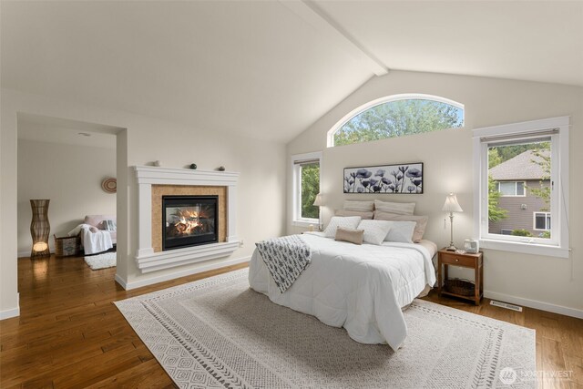 3414 SE 223rd Ave, Sammamish, WA 98075 - bedroom with lofted ceiling, wood finished floors, and a fireplace