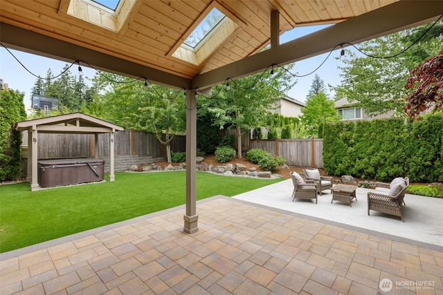 3414 SE 223rd Ave, Sammamish, WA 98075 - fenced backyard featuring a hot tub, a patio, an outdoor hangout area, and a gazebo