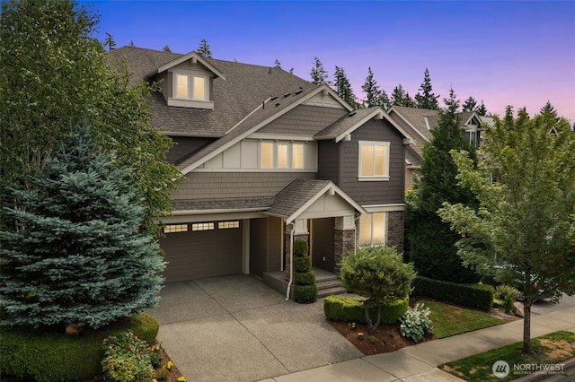 3414 SE 223rd Ave, Sammamish, WA 98075 - craftsman house with driveway, a garage, stone siding, and roof with shingles