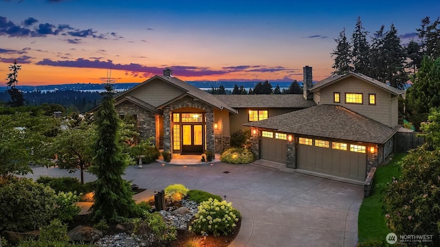 9620 NE 28th St, Clyde Hill, WA 98004 - craftsman inspired home with stone siding, an attached garage, a chimney, and driveway