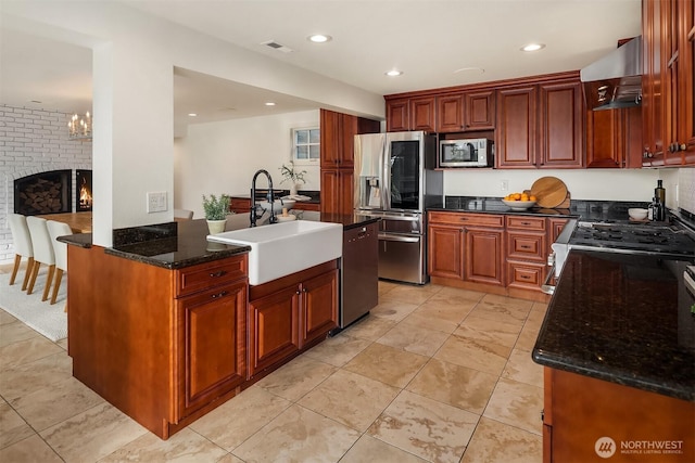 9620 NE 28th St, Clyde Hill, WA 98004 - kitchen featuring appliances with stainless steel finishes, extractor fan, dark stone counters, and recessed lighting